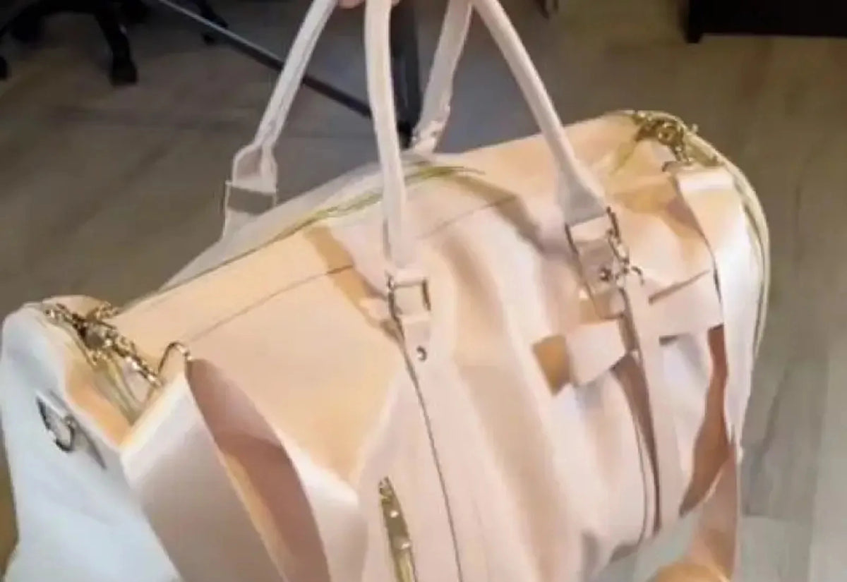 A cream Vohxe bag held up by its handles