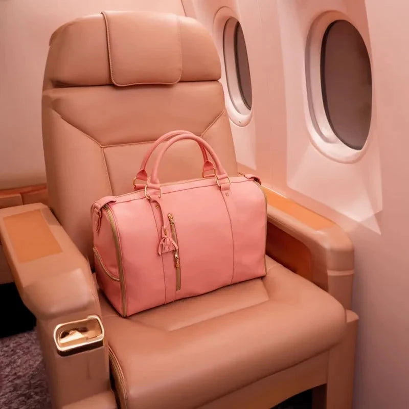 Rose Vohxe Travel Bag 2.0 on an airplane seat