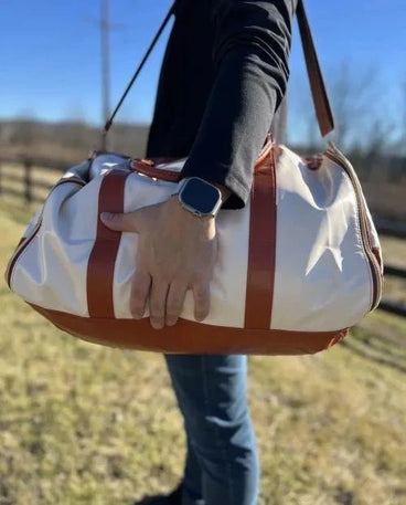 Stacy's husband carrying his Snow Vohxe bag on his shoulder outdoors
