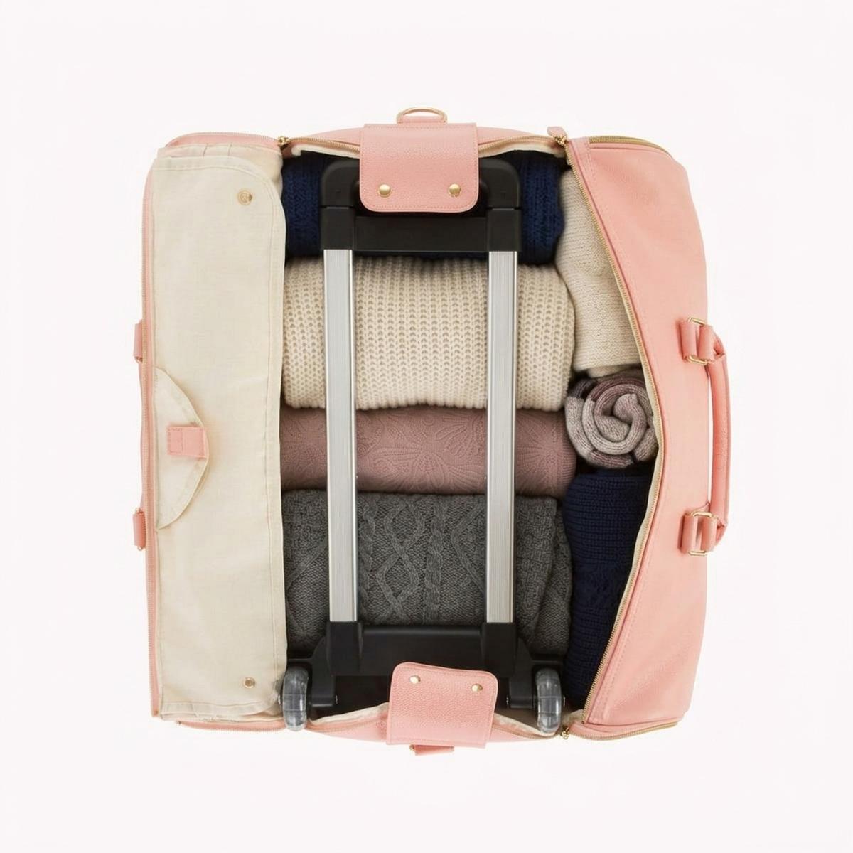 The Vohxe Travel Bag 2.0 open and packed with folded clothing