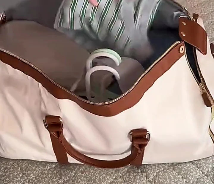 The Vohxe Travel Bag open and packed, shoes sitting in their own compartment with folded clothes alongside