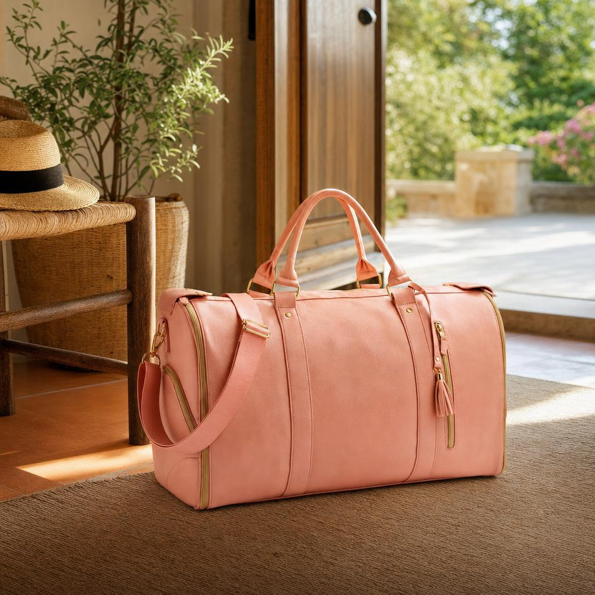 A woman at an airport with a single rose-pink Vohxe bag over her shoulder while travelers behind her wrangle large suitcases